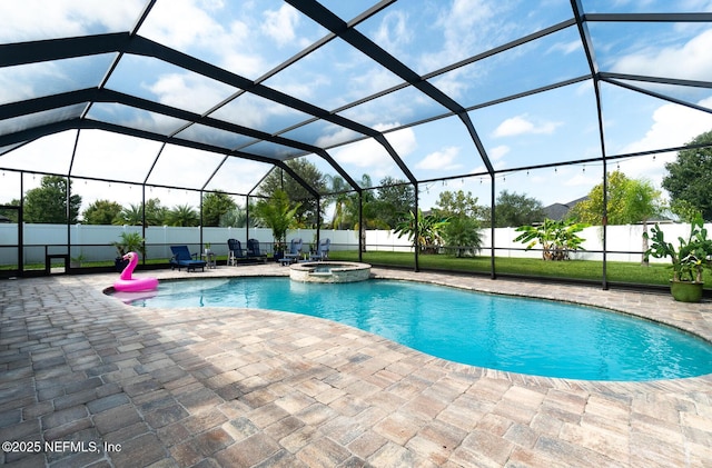 view of pool featuring a patio area and glass enclosure