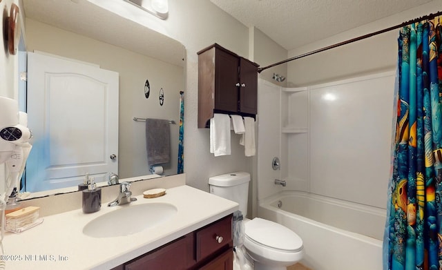 full bathroom featuring vanity, shower / bath combo, a textured ceiling, and toilet