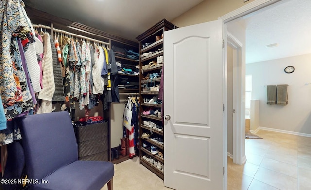 walk in closet featuring light tile patterned floors