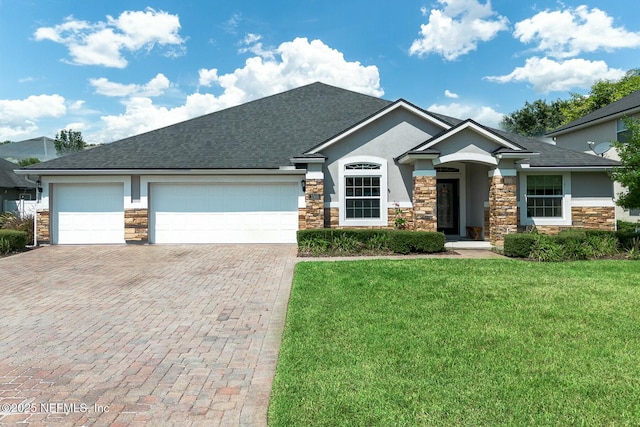 view of front of home with a garage and a front yard