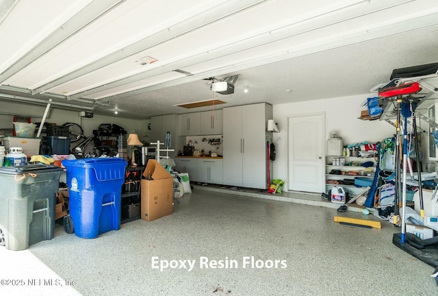 garage featuring a garage door opener