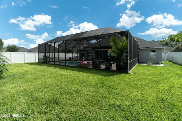 view of yard featuring a lanai and a fenced in pool