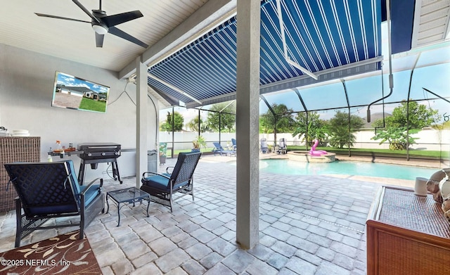 view of patio with glass enclosure, ceiling fan, and a pool with hot tub