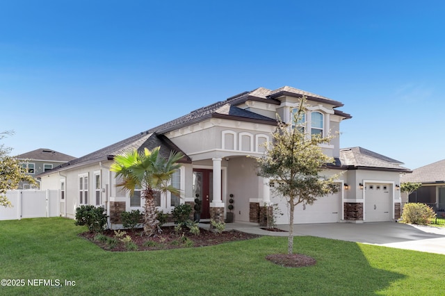 view of front of house featuring a front yard and a garage