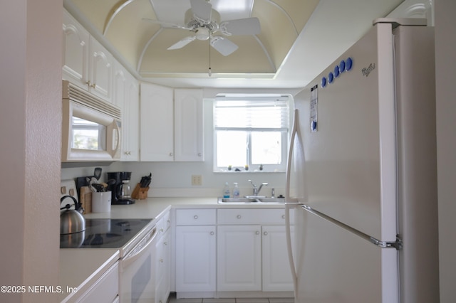 kitchen with white cabinets, white appliances, ceiling fan, and sink