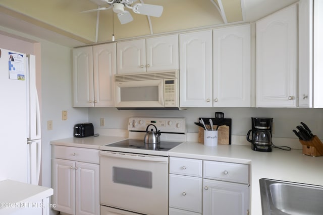 kitchen with white cabinetry, ceiling fan, and white appliances