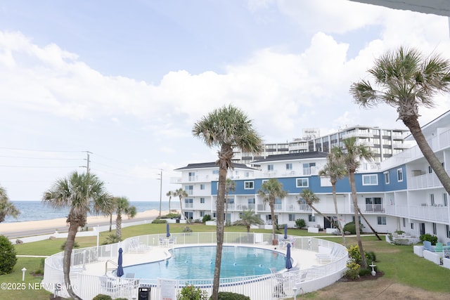 view of pool with a water view