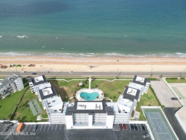 bird's eye view featuring a view of the beach and a water view