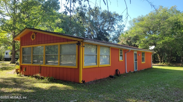 view of home's exterior with a lawn