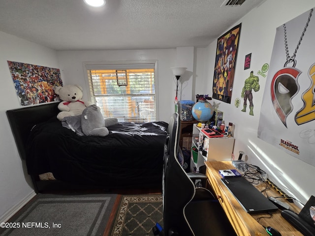 bedroom featuring a textured ceiling