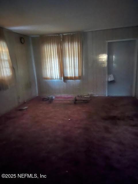 empty room with carpet flooring