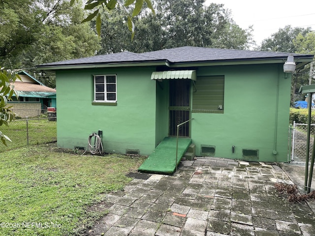 rear view of house featuring a patio