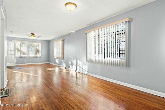 unfurnished room featuring ceiling fan and hardwood / wood-style flooring