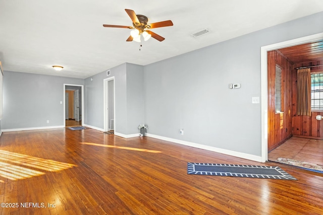 unfurnished room with ceiling fan and wood-type flooring