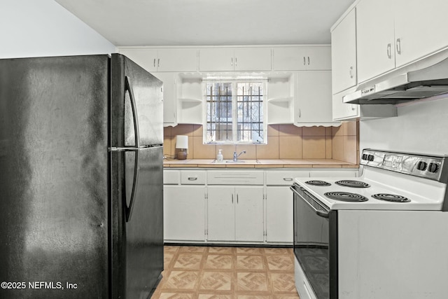 kitchen with white cabinets, black fridge, white electric stove, and sink