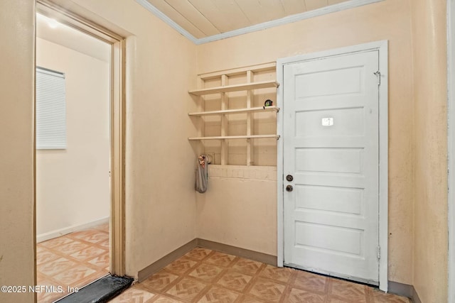 doorway to outside with light parquet flooring and crown molding