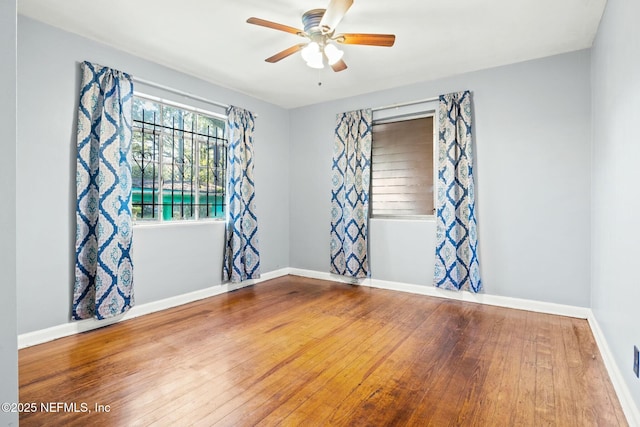 unfurnished room featuring hardwood / wood-style flooring and ceiling fan