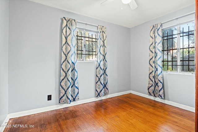 unfurnished room featuring hardwood / wood-style floors and ceiling fan