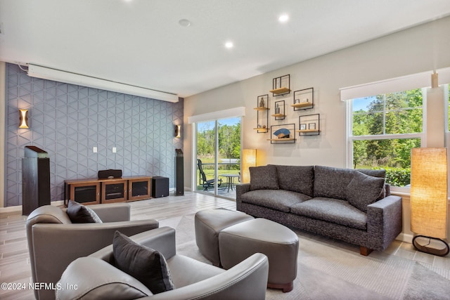 living room with hardwood / wood-style floors and a healthy amount of sunlight