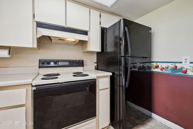 kitchen with white range with electric stovetop, black refrigerator, and white cabinets