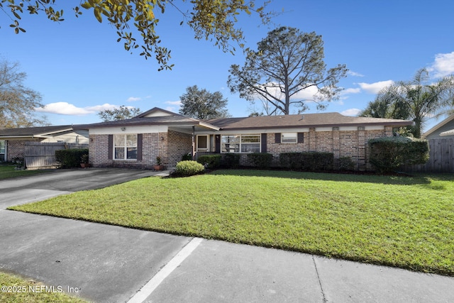 single story home with a front lawn