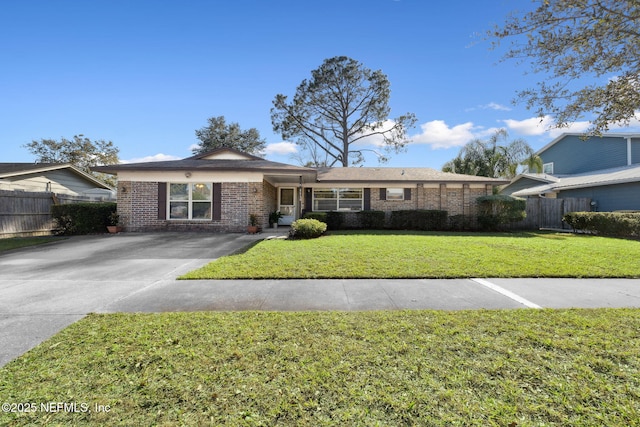 ranch-style house with a front lawn