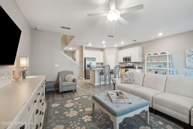 living room with ceiling fan