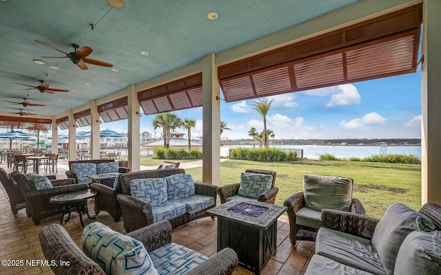 view of patio / terrace with an outdoor living space and a water view