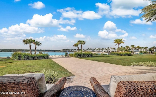 view of patio with a water view