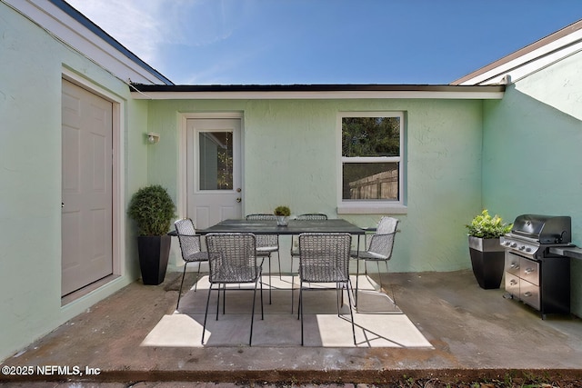 view of patio / terrace with a grill and outdoor dining space