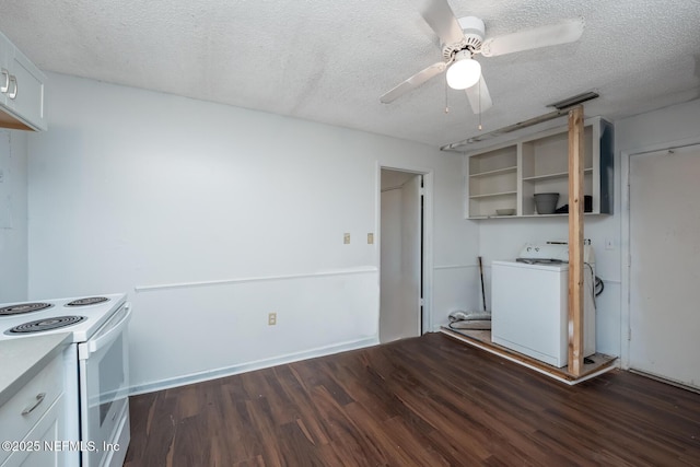 kitchen featuring white range with electric stovetop, white cabinetry, a textured ceiling, and washer / dryer