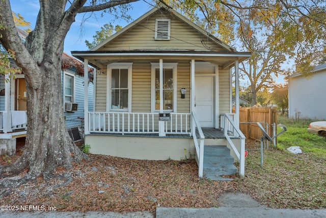 bungalow-style house featuring cooling unit and covered porch