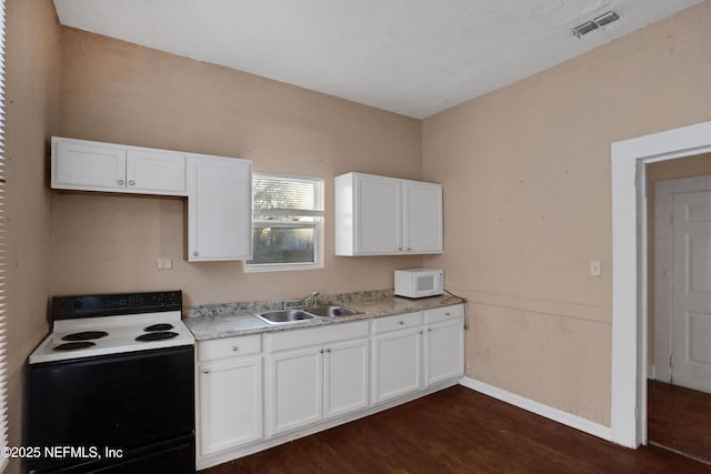 kitchen with white cabinetry, dark hardwood / wood-style flooring, white appliances, and sink