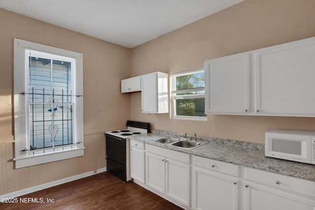 kitchen featuring sink, white cabinets, a healthy amount of sunlight, and white appliances