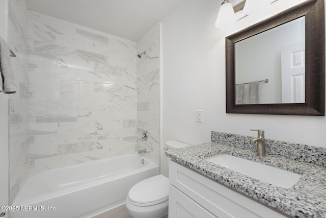 full bathroom with vanity, toilet, and tiled shower / bath