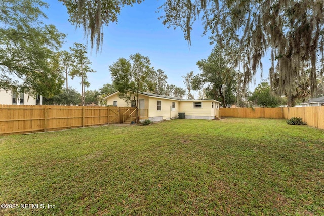 view of yard featuring central AC