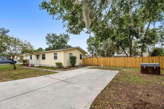 view of side of property featuring a yard