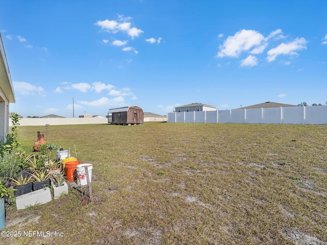 view of yard featuring a storage unit