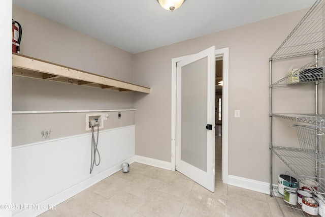 clothes washing area with hookup for a washing machine and electric dryer hookup