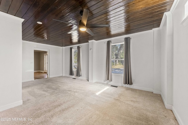 carpeted empty room with ornamental molding and ceiling fan