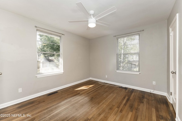 unfurnished room with ceiling fan and hardwood / wood-style flooring