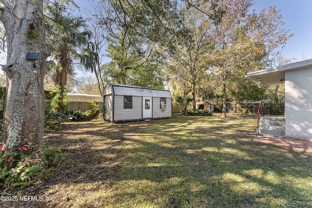 view of yard featuring a storage unit