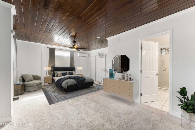 bedroom featuring ensuite bath, a wall unit AC, light carpet, ceiling fan, and wooden ceiling