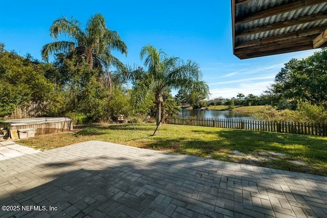 view of patio with a water view