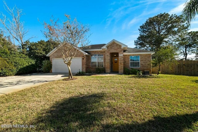 ranch-style house with a garage and a front lawn