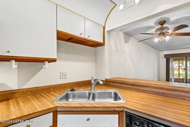 kitchen with wood counters, ceiling fan, sink, dishwasher, and white cabinetry