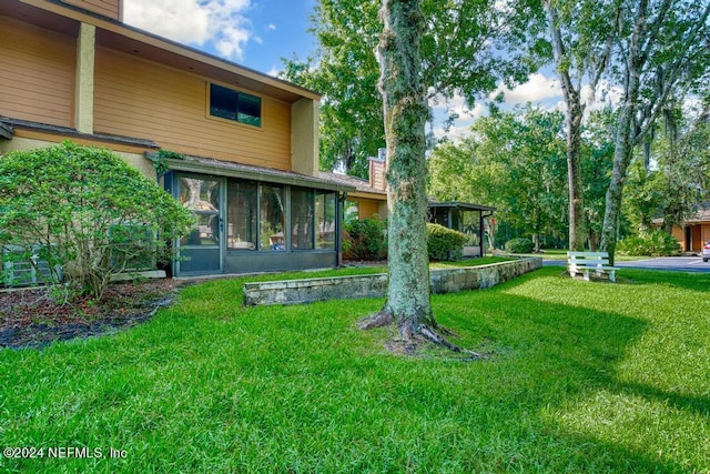 view of yard with a sunroom