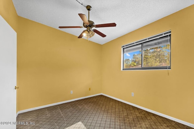 empty room with carpet flooring, a textured ceiling, and ceiling fan