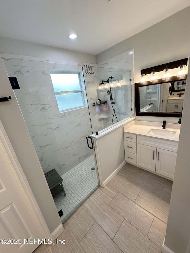 bathroom with vanity and walk in shower