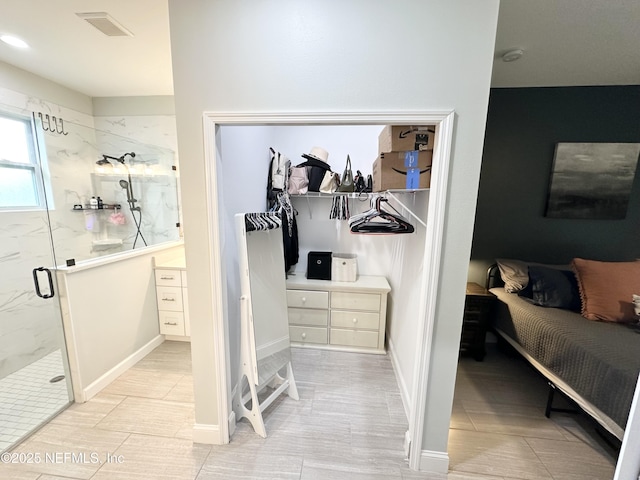 bathroom with a shower with shower door